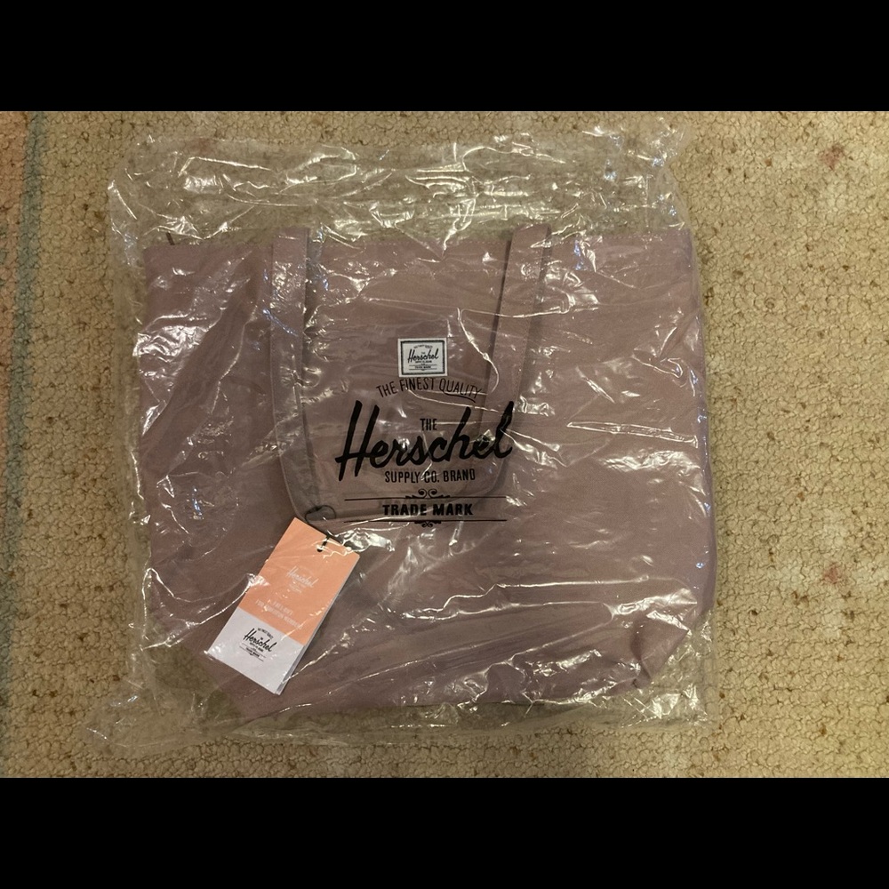 Mica Tote from Herschel Supply Co.   Brand new in packaging.  Zipper closure.